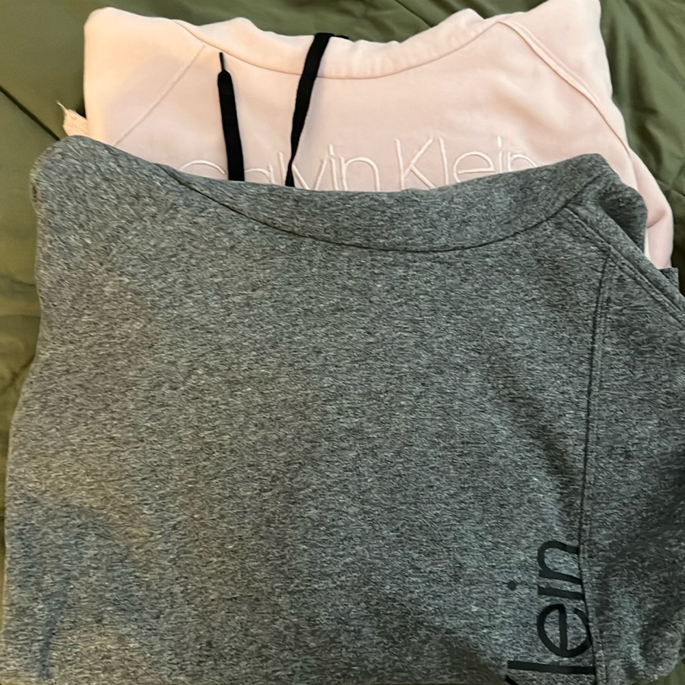 2 Calvin Klein sweatshirts one grey and one pink